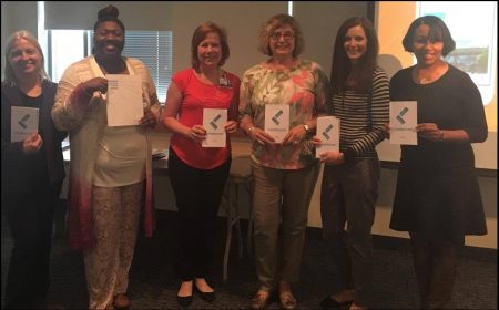 Holding their Leadercast programs are from left, Anita Mattero (Sibley Core Lab Manager), Tabitha Little-Baker (Suburban Hospital Hematology Technical Specialist), Debbie Aird, Marie Moninger (Suburban Hospital Core Lab Manager), Chris Calvelli (Suburban Hospital QA Coordinator), and Arneal Crocker (Transfusion Medicine Manager, Suburban and Sibley Hospitals). 